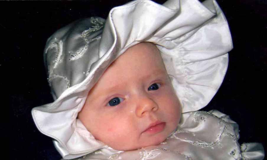 Baby in christening outfit